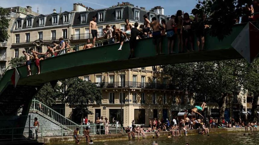 Parisians seek refuge from heatwave in air-conditioned hotels